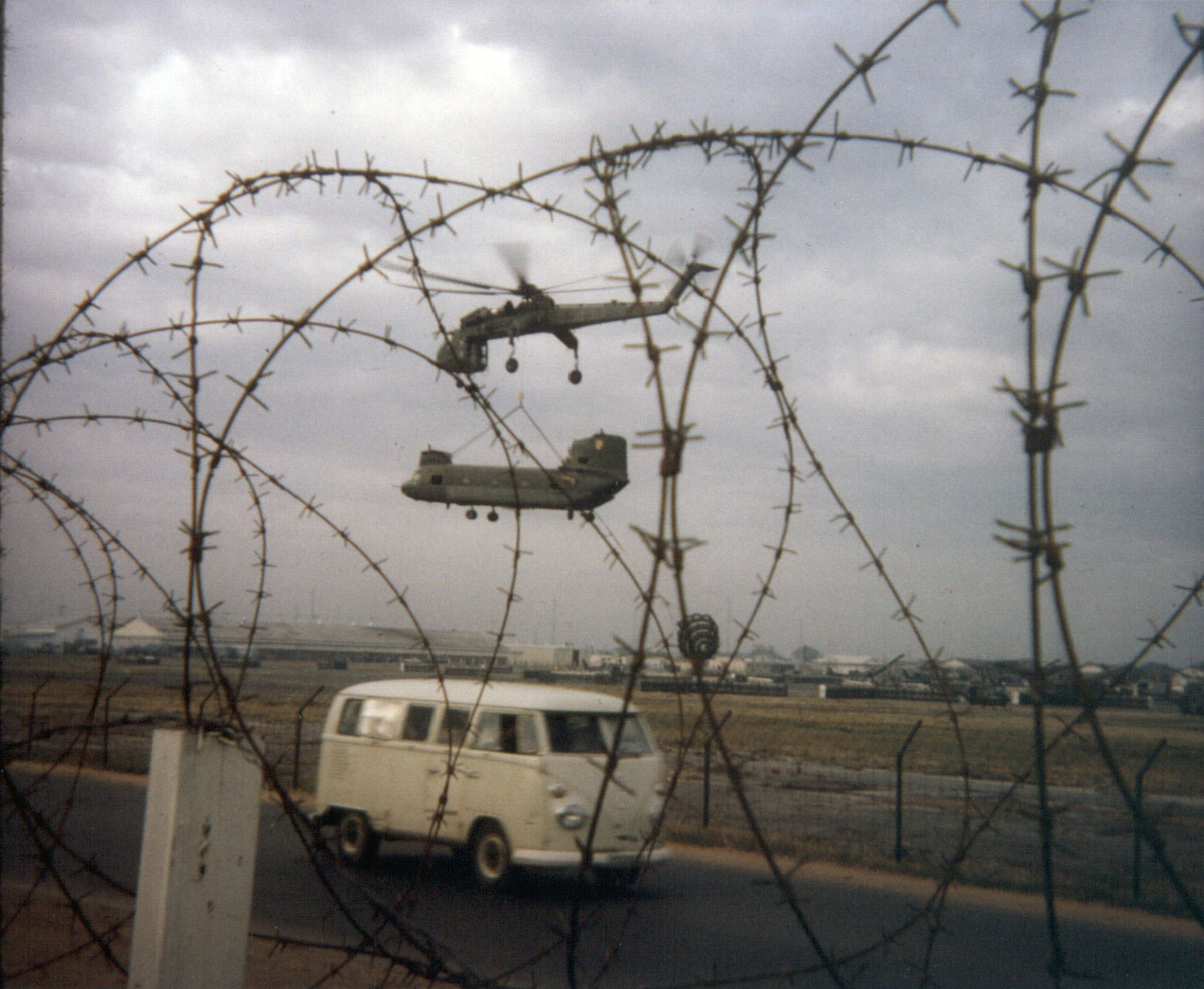 Damaged helicopter being lifted to US Army facility at Ton Son Nhut Airbase