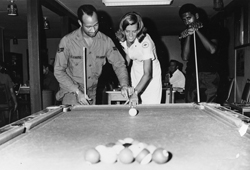 Jennifer Young playing pool with soldiers