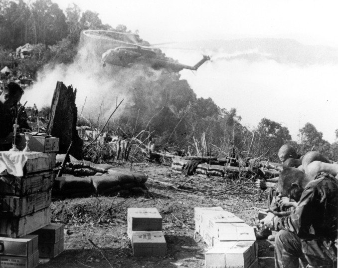 Moments of peace-- Infantrymen of the Ninth Marines and artillerymen of Twelfth Marines take time to attend church services at Fire Support Base Razor. The Chaplain was Lieutenant S. Rubino, United States Navy Battation Chaplain. [Lee Roy Herron in bottom right corner] 