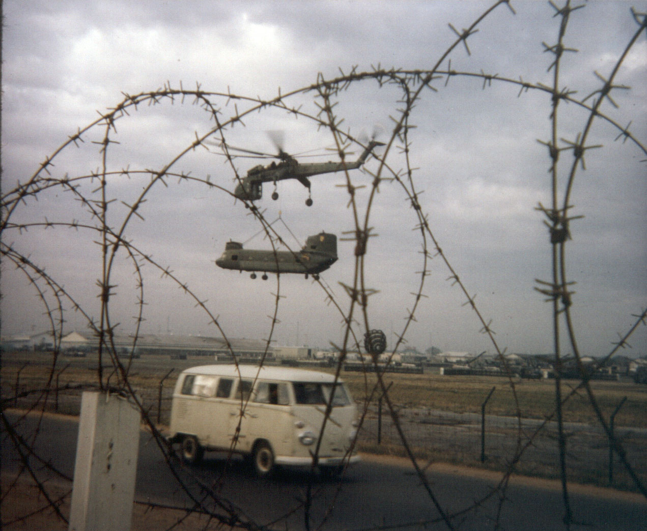 Damaged helicopter being lifted to US Army facility at Ton Son Nhut Airbase 