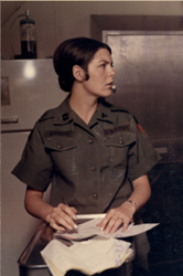 Cpt. Lynda Ankron goes over some paperwork at the 24th Evacuation Hospital