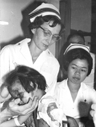 Navy nurse caring for sick child